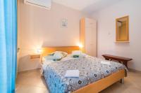 Posteľ alebo postele v izbe v ubytovaní Apartment Vilma Funtana