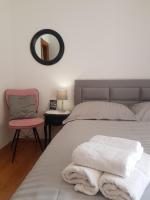 Postel nebo postele na pokoji v ubytování Apartments Karlo