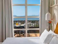 A bed or beds in a room at H10 Rubicón Horizons Collection
