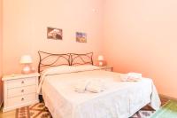 A bed or beds in a room at Antica Dimora del Melograno