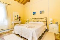 A bed or beds in a room at Antica Dimora del Melograno
