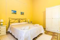 A bed or beds in a room at Antica Dimora del Melograno