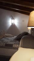 Postel nebo postele na pokoji v ubytování Casas Rurales Almoguer