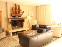 a living room with a couch and a fireplace at Beautiful country house with enclosed garden in green surroundings in Burgundy in Bouix