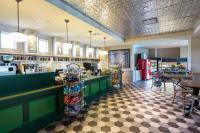 a fast food restaurant with green counters and tables at Dollywood's DreamMore Resort and Spa in Pigeon Forge