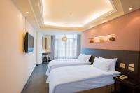Ein Bett oder Betten in einem Zimmer der Unterkunft Bitan Hotel