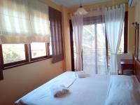 Posteľ alebo postele v izbe v ubytovaní Ostria Maisonettes and Studios