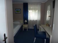 Postel nebo postele na pokoji v ubytování Hotel Pelikan