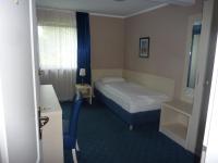 Postel nebo postele na pokoji v ubytování Hotel Pelikan