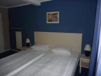 Postel nebo postele na pokoji v ubytování Hotel Pelikan