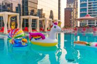 a swimming pool with some toys in the water at Canal Central Hotel Business Bay in Dubai