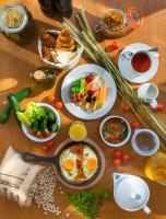 a table topped with plates of breakfast foods and drinks at Canal Central Hotel Business Bay in Dubai