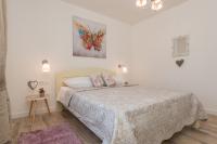 Postel nebo postele na pokoji v ubytování Sakarun House - Ivana
