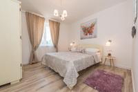 Postel nebo postele na pokoji v ubytování Sakarun House - Ivana