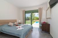 Posteľ alebo postele v izbe v ubytovaní Eora Bungalows