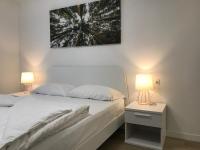 Łóżko lub łóżka w pokoju w obiekcie Trentino Apartments - Casa ai Tolleri