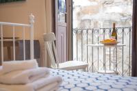 Posteľ alebo postele v izbe v ubytovaní Casa Miele Ortigia