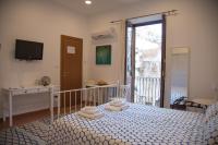 Posteľ alebo postele v izbe v ubytovaní Casa Miele Ortigia