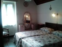 A bed or beds in a room at villatiffany