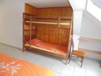 Łóżko lub łóżka w pokoju w obiekcie Álmos Apartman