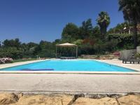 a swimming pool with a gazebo in a yard at Le Gîte du DAB in La Cadière-dʼAzur