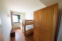 A bed or beds in a room at Bouganvilla