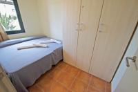 A bed or beds in a room at Bouganvilla