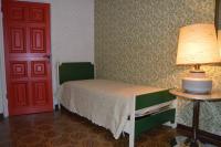A bed or beds in a room at B&B VILLA LUPIDI