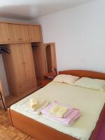 Posteľ alebo postele v izbe v ubytovaní Apartmani Rosanda