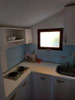 Kuchyňa alebo kuchynka v ubytovaní Apartmani Rosanda