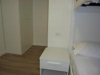 Łóżko lub łóżka w pokoju w obiekcie Trentino Apartments - Casa ai Tolleri