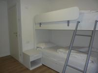 Łóżko lub łóżka w pokoju w obiekcie Trentino Apartments - Casa ai Tolleri