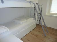 Łóżko lub łóżka w pokoju w obiekcie Trentino Apartments - Casa ai Tolleri