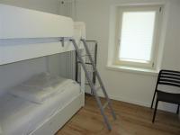 Łóżko lub łóżka w pokoju w obiekcie Trentino Apartments - Casa ai Tolleri