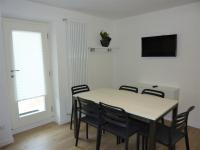 Telewizja i/lub zestaw kina domowego w obiekcie Trentino Apartments - Casa ai Tolleri