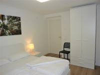 Łóżko lub łóżka w pokoju w obiekcie Trentino Apartments - Casa ai Tolleri