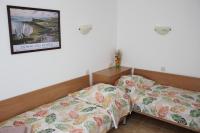 Postel nebo postele na pokoji v ubytování Hotel Radik