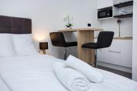 Posteľ alebo postele v izbe v ubytovaní SENZACIJA apartments