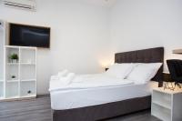 Posteľ alebo postele v izbe v ubytovaní SENZACIJA apartments