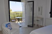 Postel nebo postele na pokoji v ubytování Nefeli Villas
