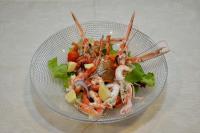 a glass bowl of shrimp and salad with lettuce at Albergo Italia in Porto Tolle