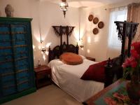 a bedroom with a bed and a blue dresser at Maison Lolly corse wifii free in Borgo