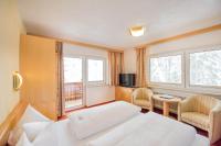 Łóżko lub łóżka w pokoju w obiekcie Hotel Garni Waldhof - Wohlfühlen am Lech