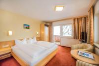 Łóżko lub łóżka w pokoju w obiekcie Hotel Garni Waldhof - Wohlfühlen am Lech