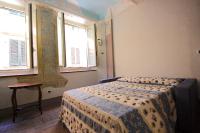 Łóżko lub łóżka w pokoju w obiekcie Il Giardino Apartment