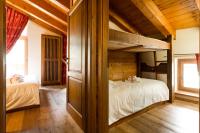 Posteľ alebo postele v izbe v ubytovaní Le Petit Coeur Residence De Montagne