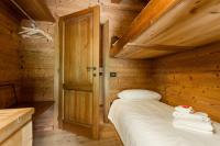 Posteľ alebo postele v izbe v ubytovaní Le Petit Coeur Residence De Montagne