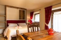 Posteľ alebo postele v izbe v ubytovaní Le Petit Coeur Residence De Montagne