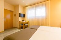 Postel nebo postele na pokoji v ubytování Apartamentos DV