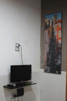 A television and/or entertainment centre at A due passi dal Duomo